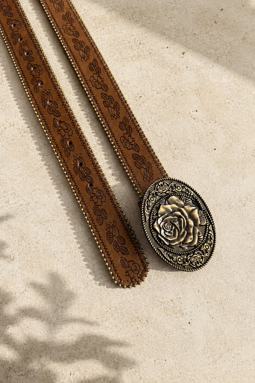 Camel brown Western PU leather belt with embossed botanical detailing, antique metal accents, and oversized rose buckle.