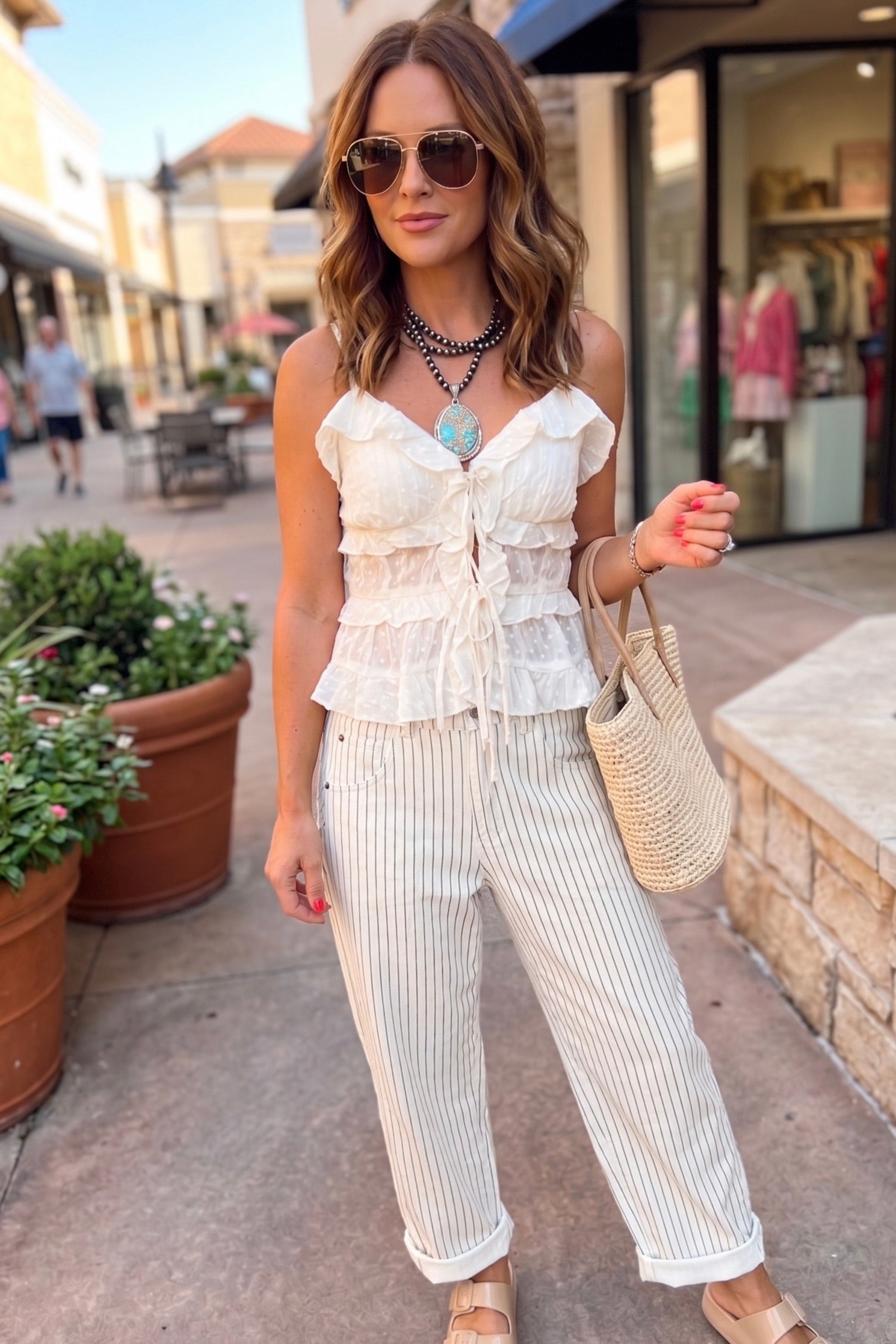 Cream ruffle front tie mesh tank. perfect for weekend getaways, lunch with friends, or errands