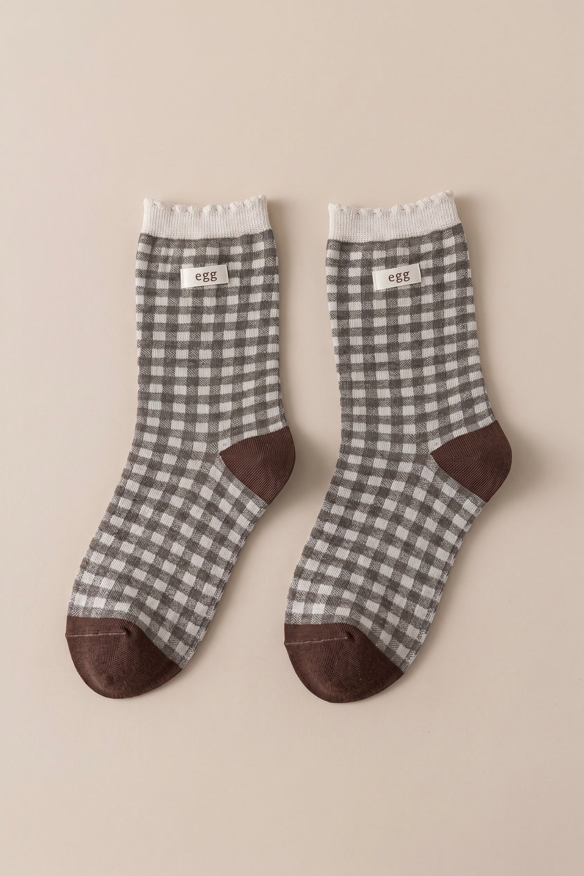 Women's blue gingham check crew socks with contrasting blue heel, toe and cuff details.