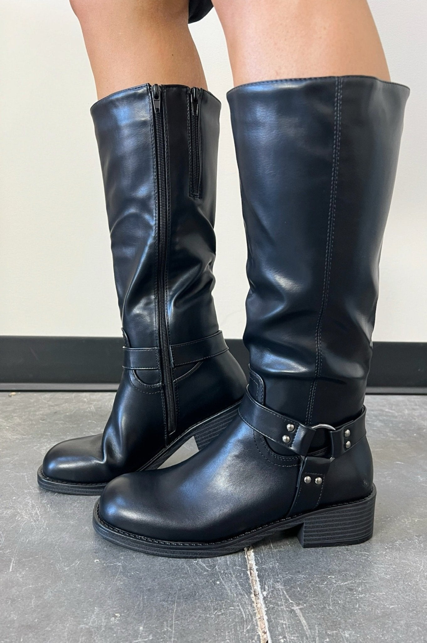 black riding style boots with ring belt connecting three sides