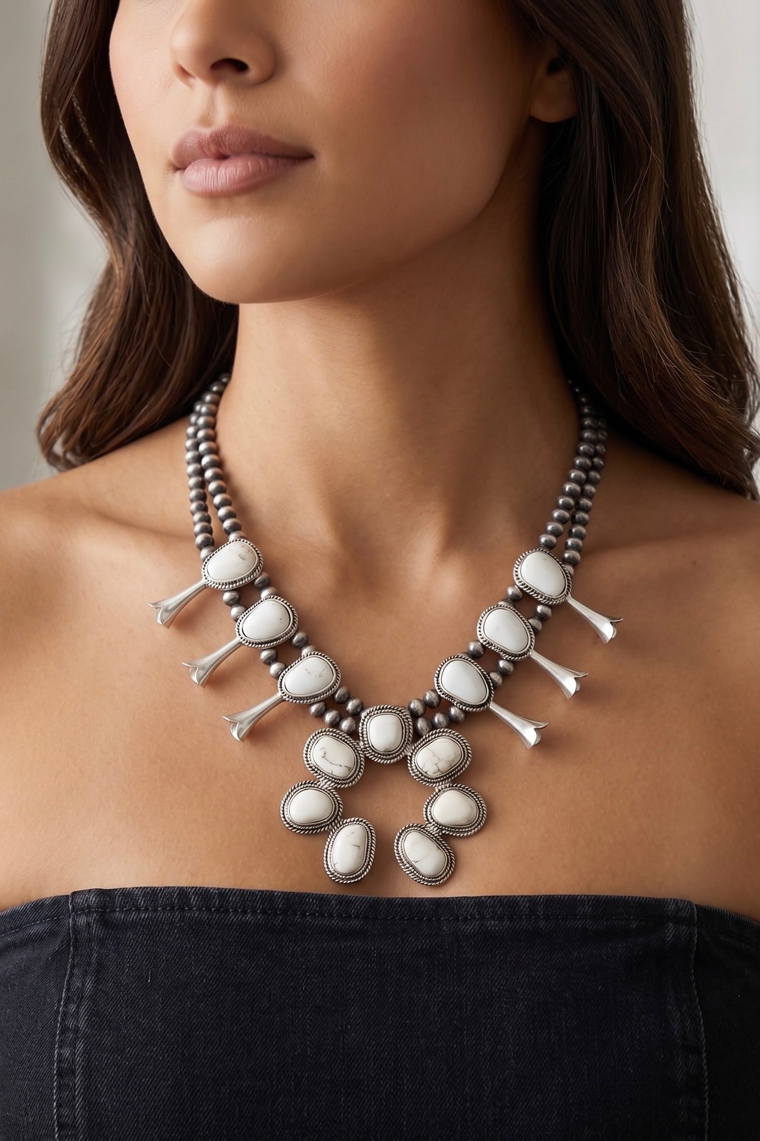 Handmade white turquoise squash blossom necklace with natural stones, antique silver-tone beads and statement center pendant.
