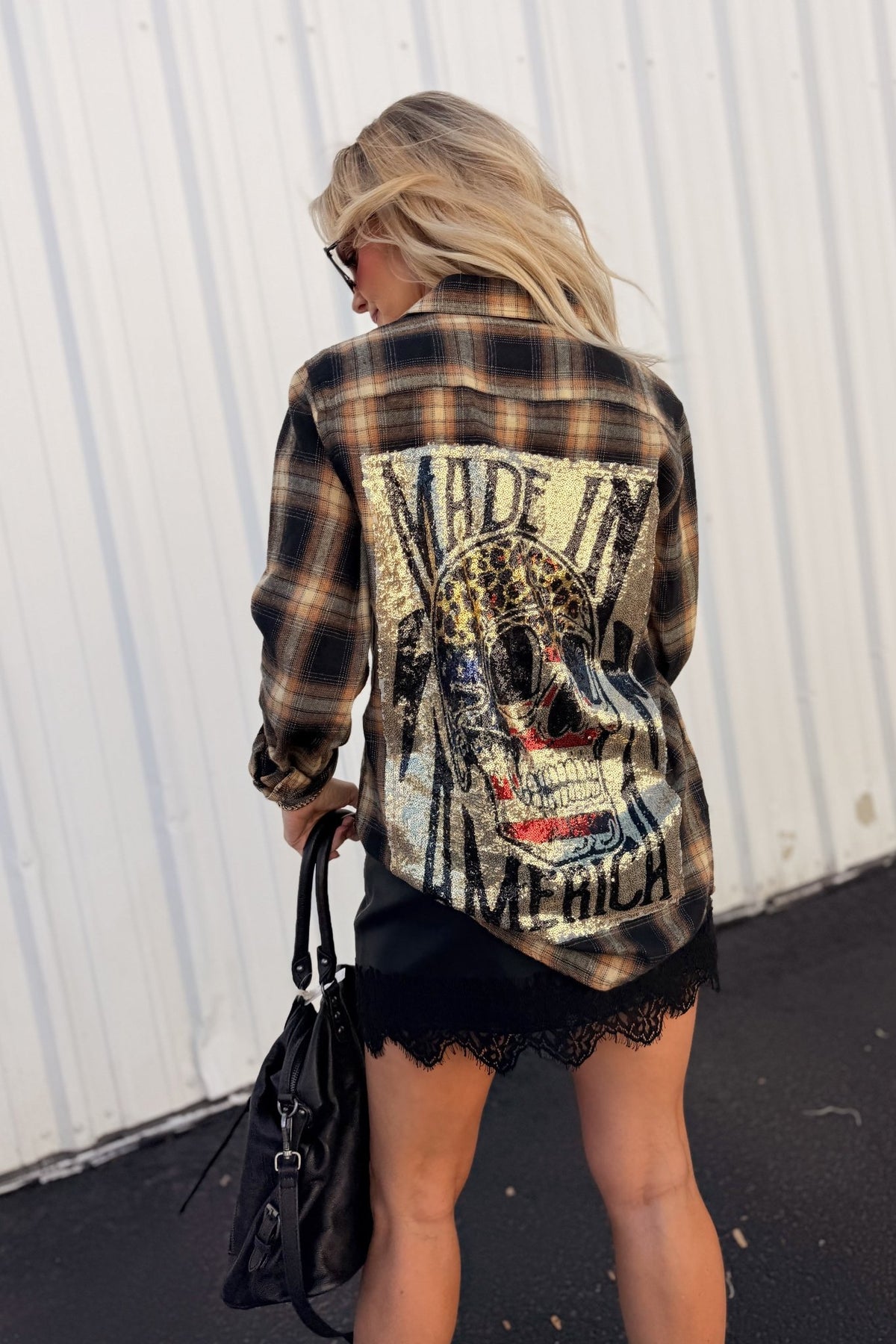 Women’s red, black and cream plaid flannel button-down shirt featuring a relaxed oversized fit, collared neckline, long sleeves, button front closure and dual chest flap pockets. Classic tartan plaid shirt styled as an easy layering piece for casual, grunge-inspired and fall outfits.