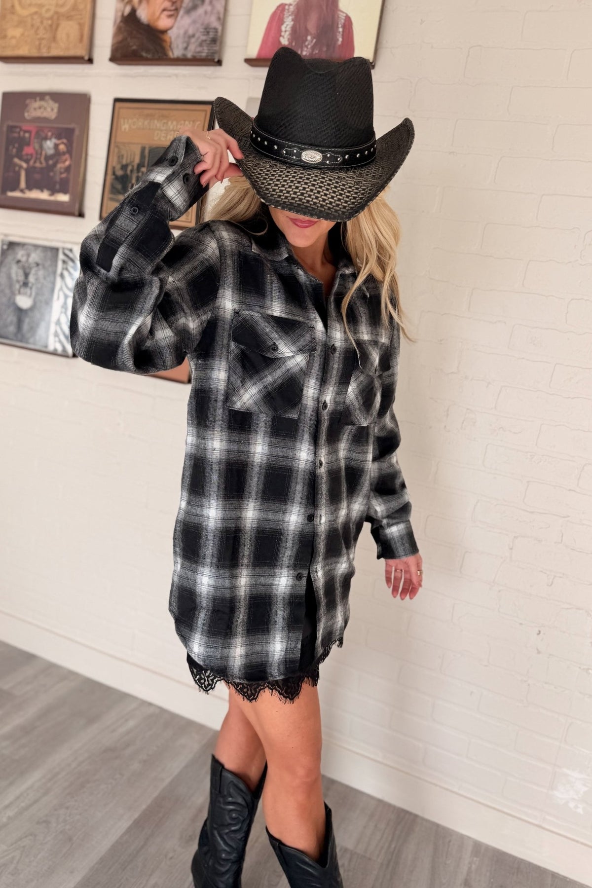 Women’s red, black and cream plaid flannel button-down shirt featuring a relaxed oversized fit, collared neckline, long sleeves, button front closure and dual chest flap pockets. Classic tartan plaid shirt styled as an easy layering piece for casual, grunge-inspired and fall outfits.