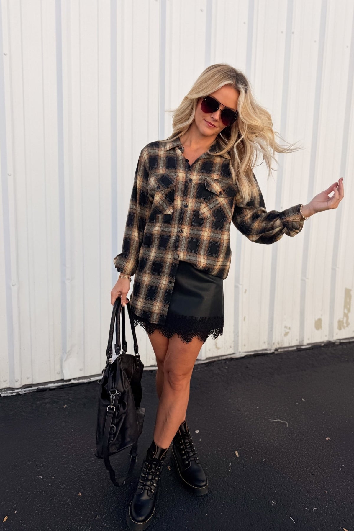 Women’s red, black and cream plaid flannel button-down shirt featuring a relaxed oversized fit, collared neckline, long sleeves, button front closure and dual chest flap pockets. Classic tartan plaid shirt styled as an easy layering piece for casual, grunge-inspired and fall outfits.