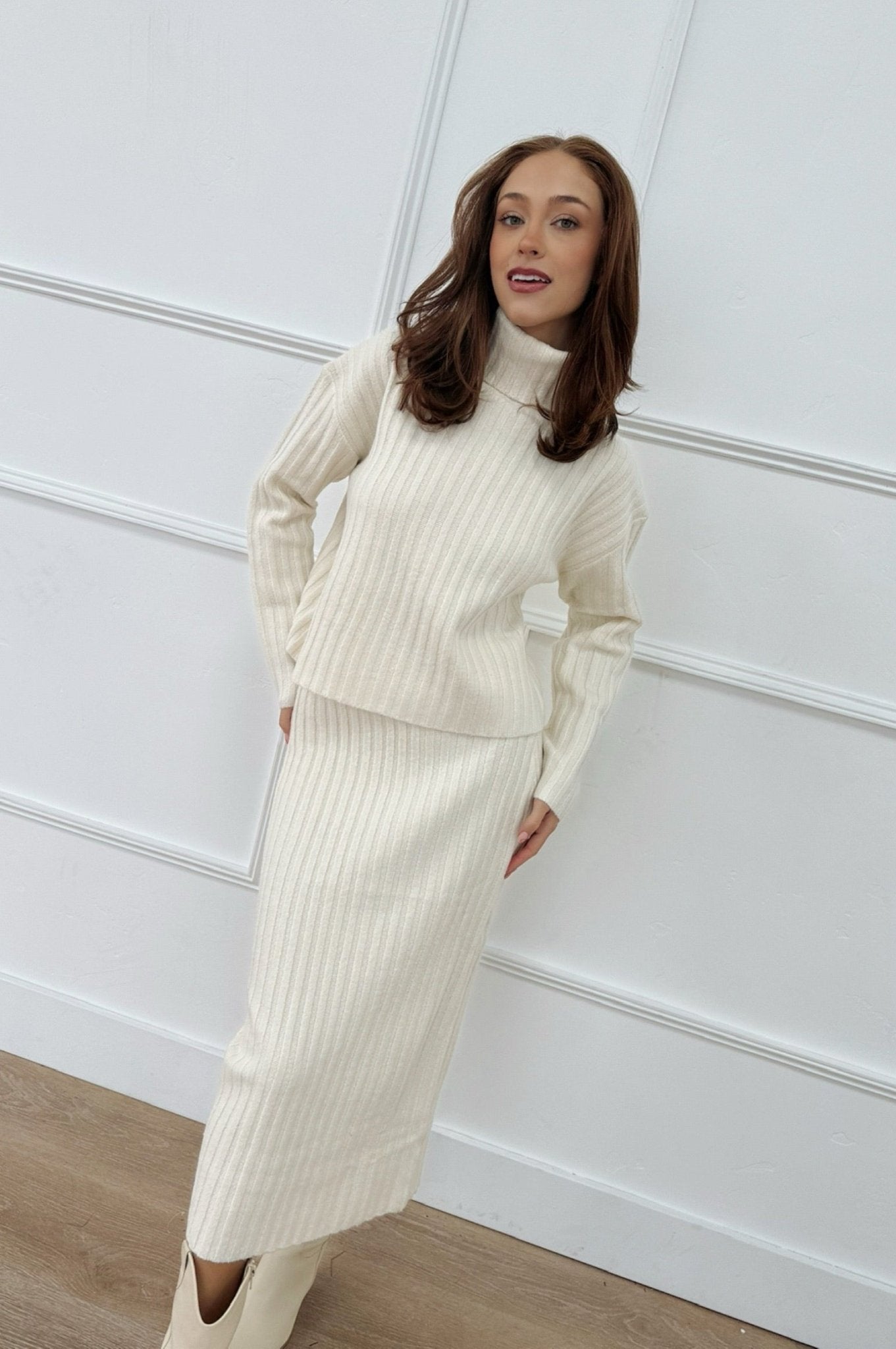 knit long sleeve turtleneck sweater with matching midi skirt