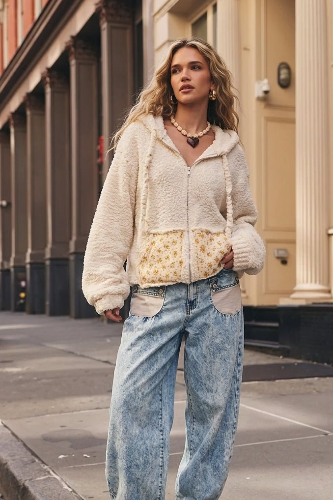 Ivory cream fuzzy textured zip-up jacket featuring a soft boucle-inspired knit, relaxed fit, long sleeves, distressed raw-edge seam detailing, and a front zipper closure. This women's boho jacket features a wide neckline that can be styled off the shoulder, cozy textured fabric, and a feminine, vintage-inspired silhouette. Perfect for layering over casual tops, pairing with denim jeans, or creating romantic bohemian, cottage core, and shabby chic outfits for fall, winter, and transitional seasons.