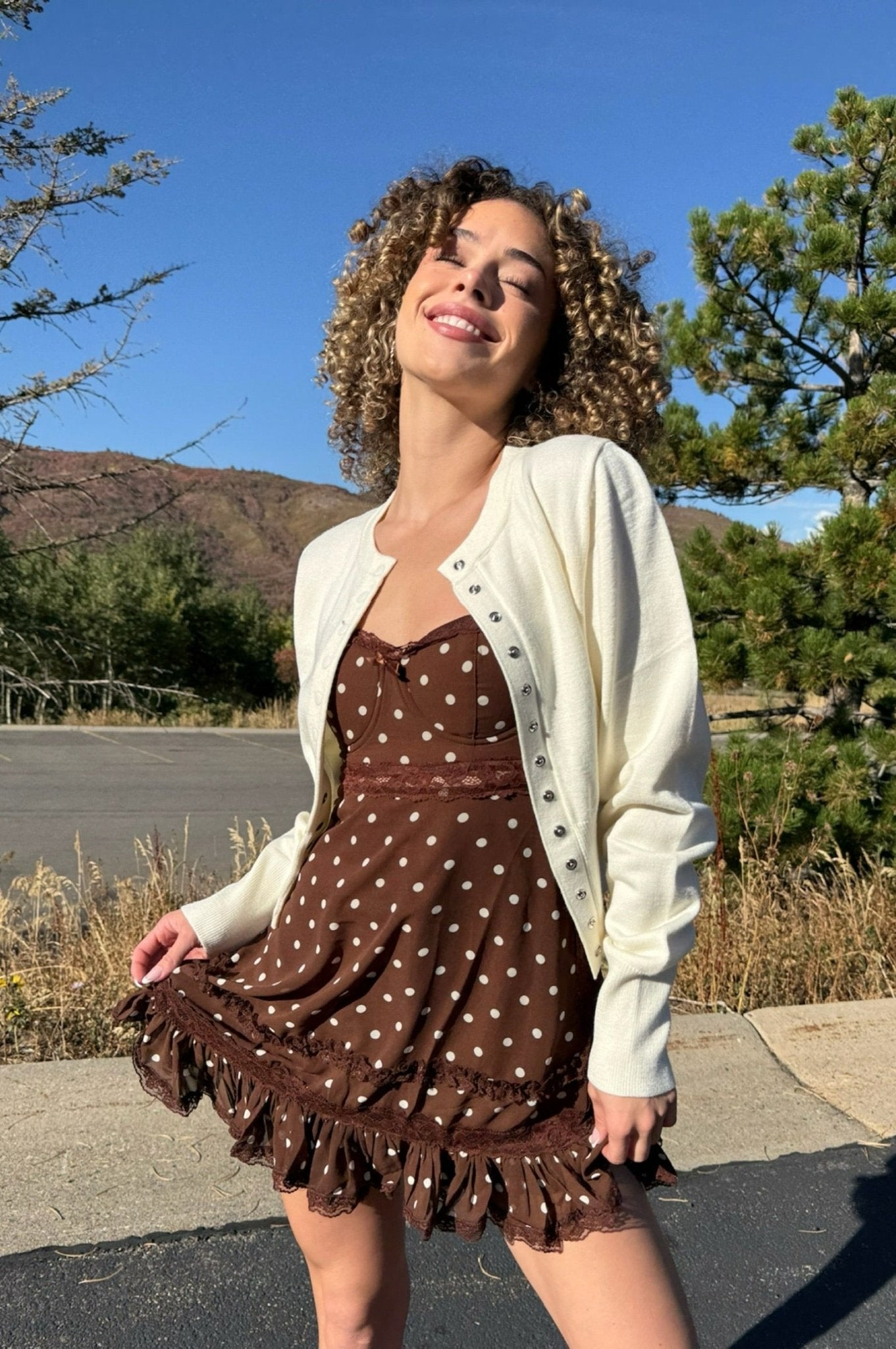 Ivory cardigan with snap closures. High quality