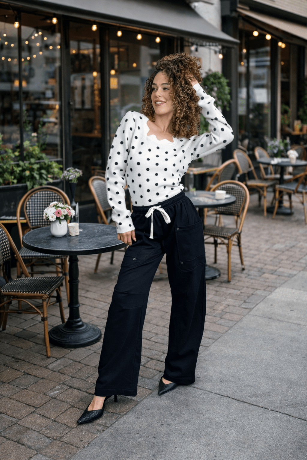 cargo sweatpants, wide leg joggers, utility pants women, black cargo pants, travel clothes for women, athleisure style, relaxed fit trousers, drawstring sweatpants, off-duty fashion