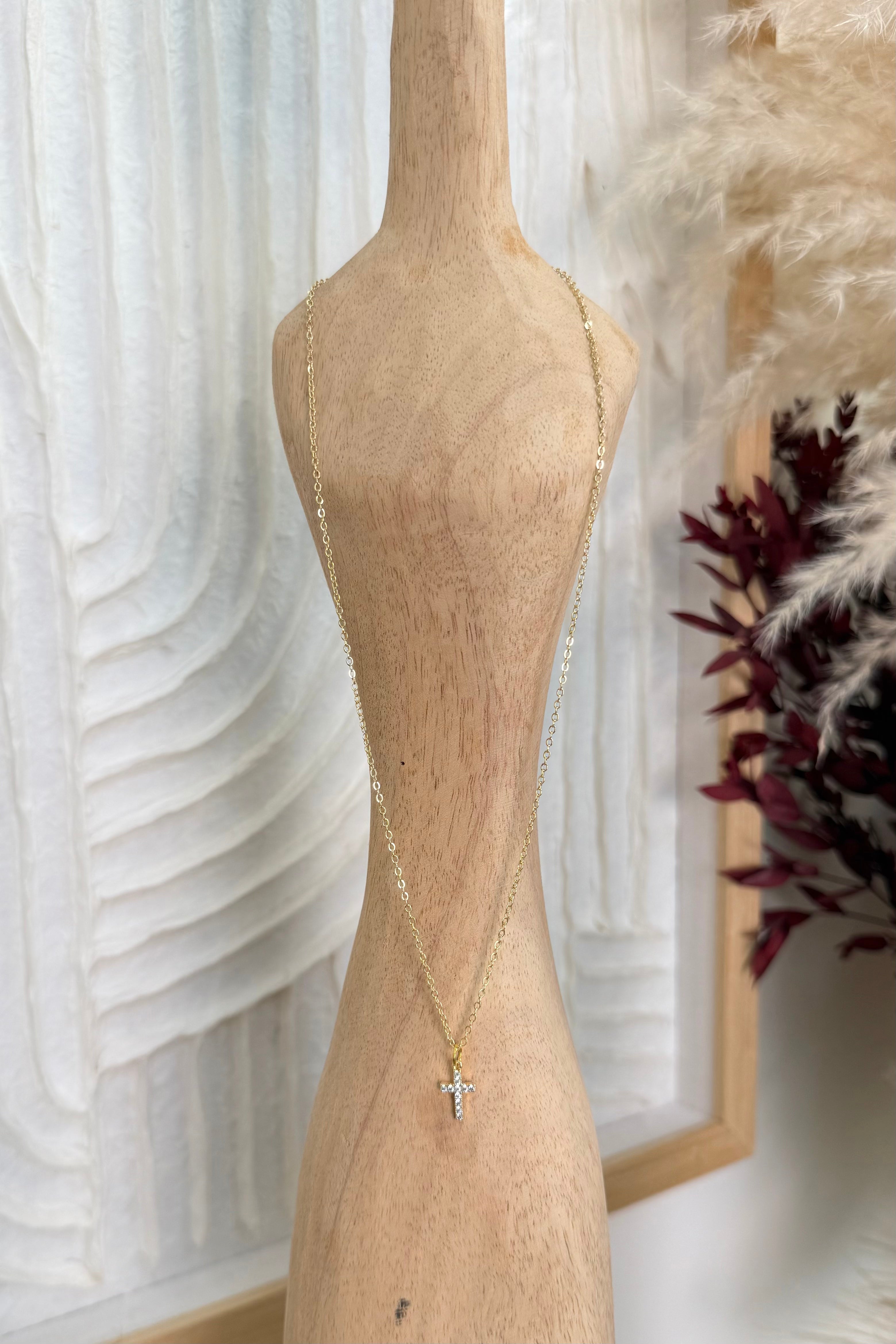 Minimal gold cross necklace with sparkling crystal accents