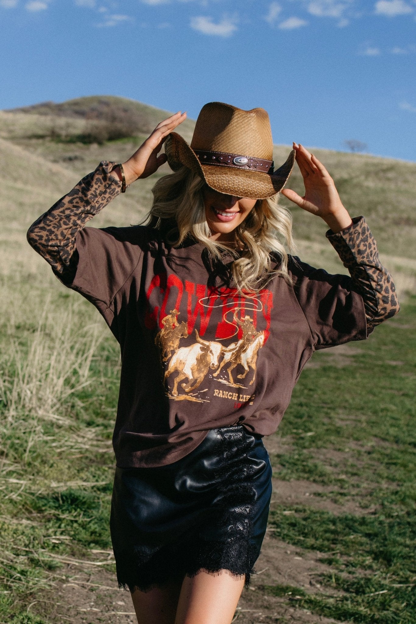 western cowboy hat styled for country concert outfits, edgy cowgirl fashion, western festival looks and boho country style from Sand + Charcoal Boutique