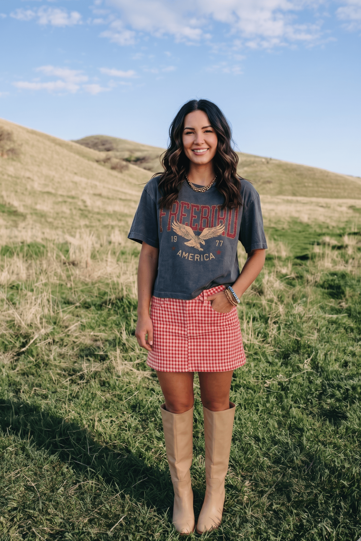 Women's Free Bird America 1977 graphic tee featuring a vintage eagle graphic, styled for country concert outfits, Americana fashion, rodeo looks, and summer western style.
