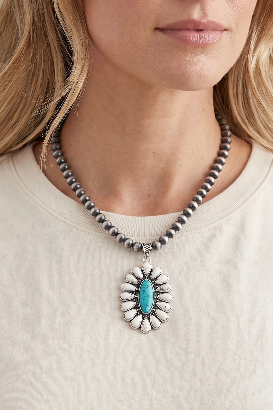 Handmade Navajo-style silver bead necklace featuring a turquoise and white turquoise floral pendant with an antique silver finish.