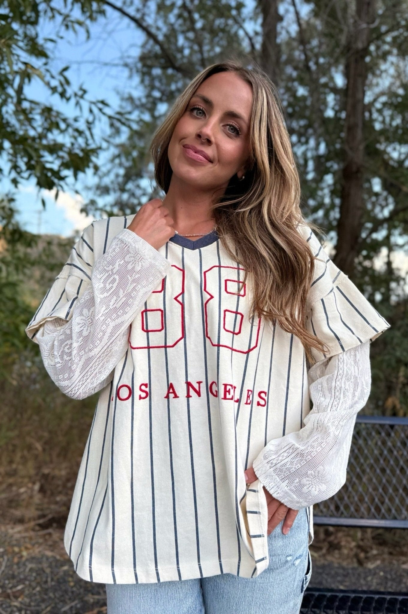 layered striped top with lace under sleeve and number 88