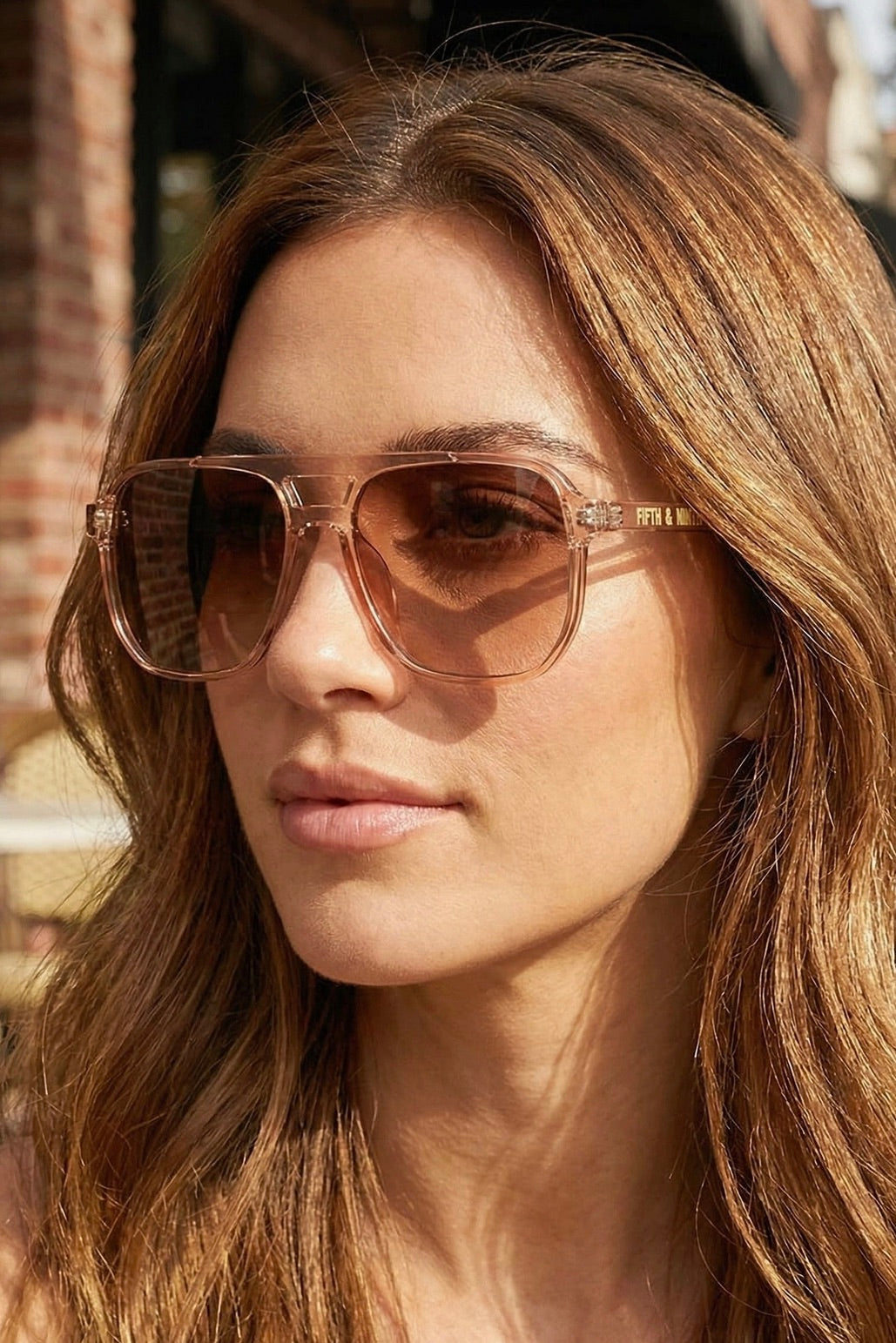 Oversized black sunglasses with blush pink lenses, a stylish accessory for country concerts, western fashion, summer vacations, and everyday wear.
