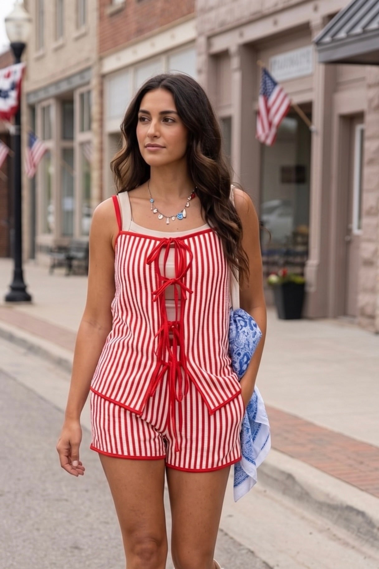 Red and white striped high-waisted shorts with contrast red trim, perfect for Fourth of July outfits, country concerts, summer festivals, rodeos, and Americana-inspired style.