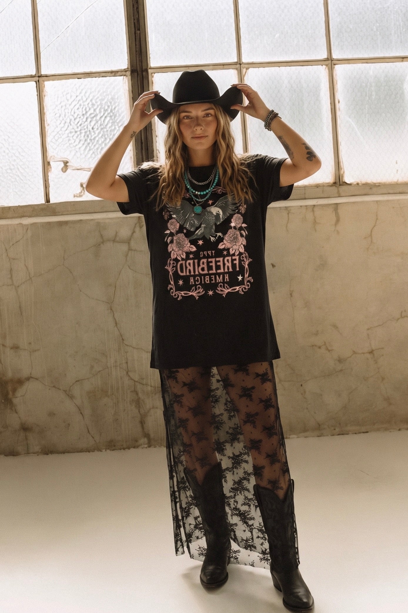 Black oversized Free Bird 1776 graphic t-shirt maxi dress with a sheer floral lace overlay and short sleeves.
