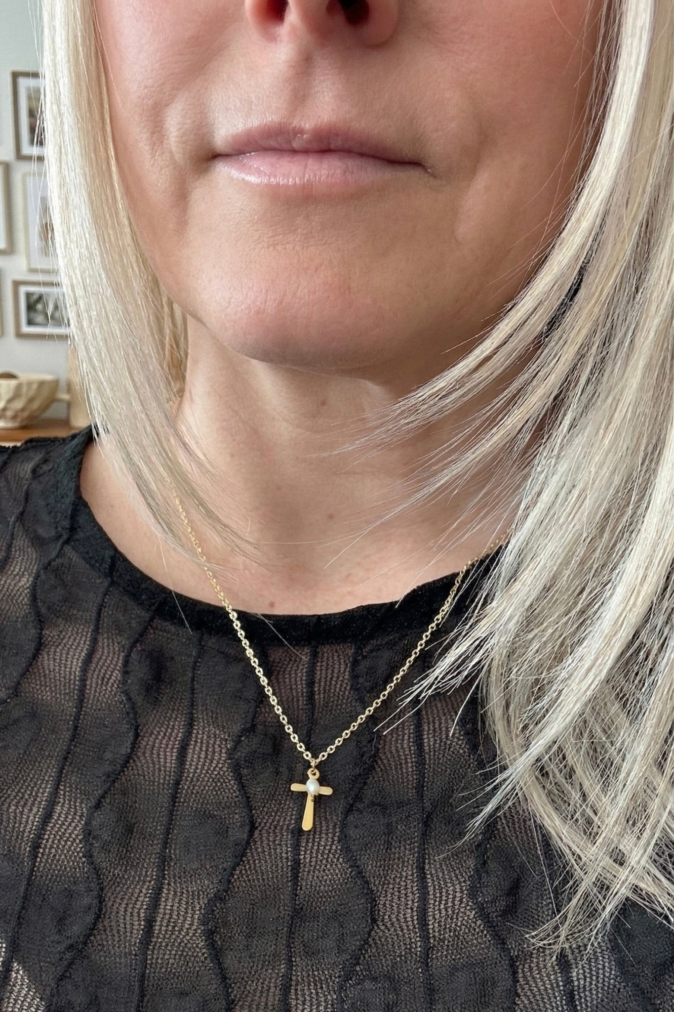 Small gold cross with a pearl charm