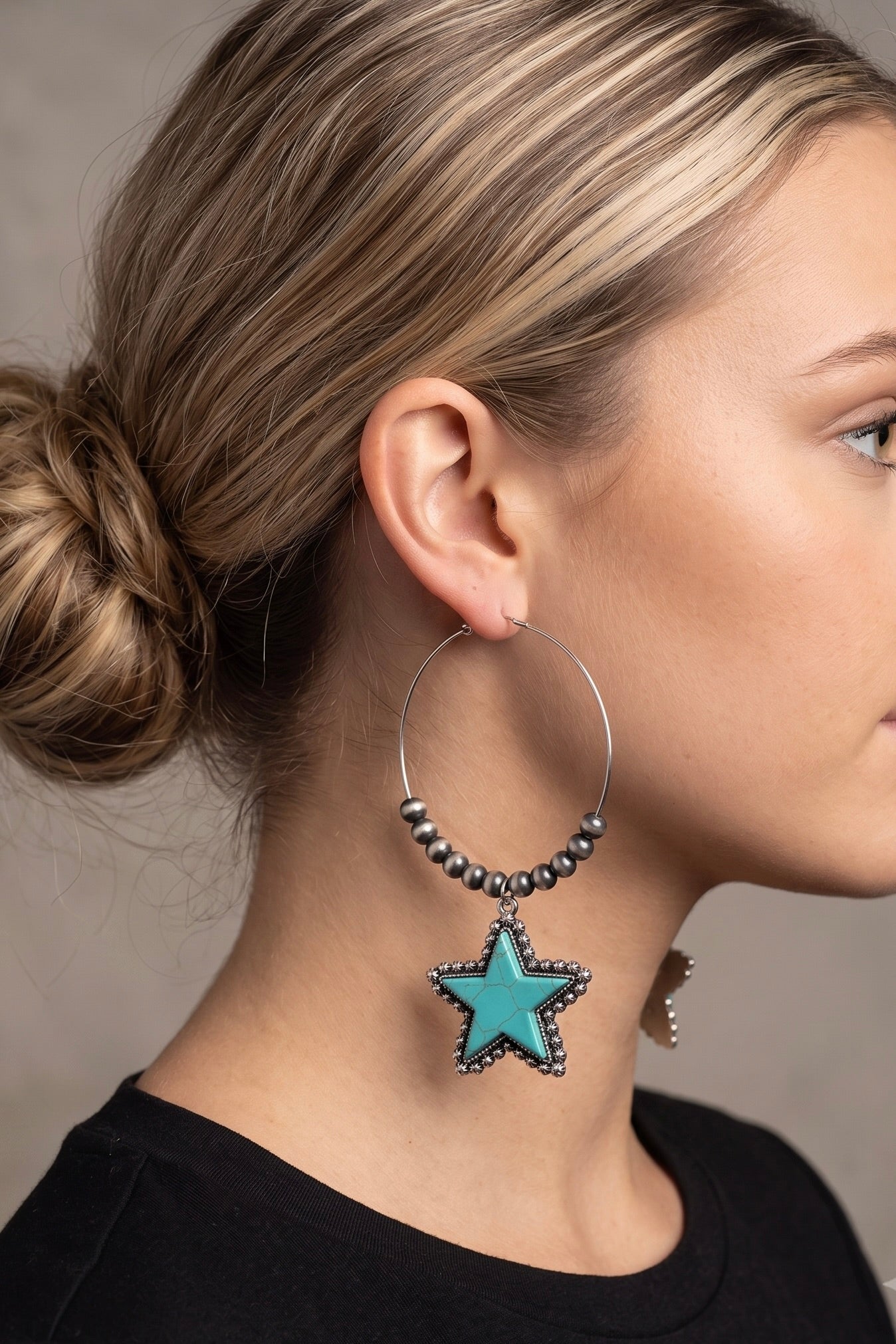 Oversized silver hoop earrings featuring turquoise star pendants, Navajo-inspired beads, and fish hook closures with an antique silver finish.