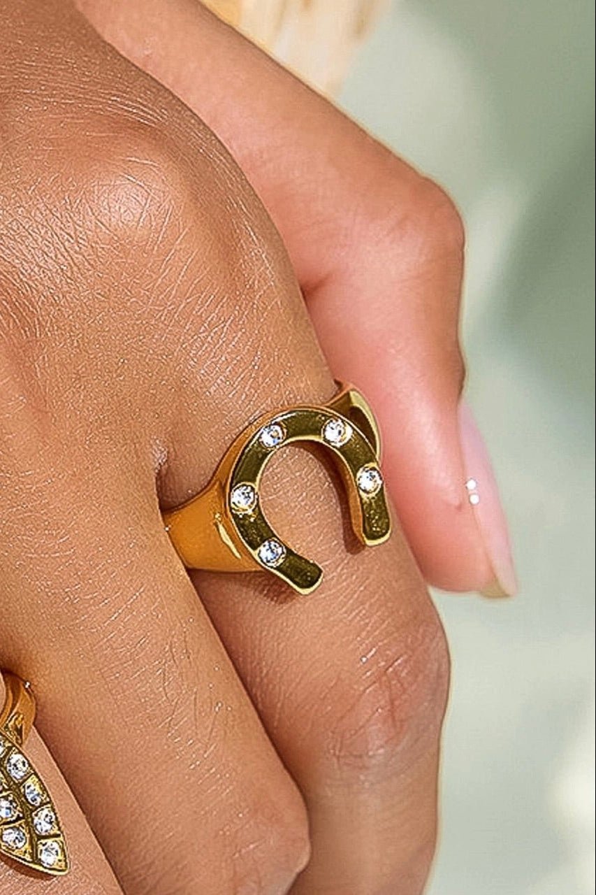 gold horse shoe ring with crystal accent throughout