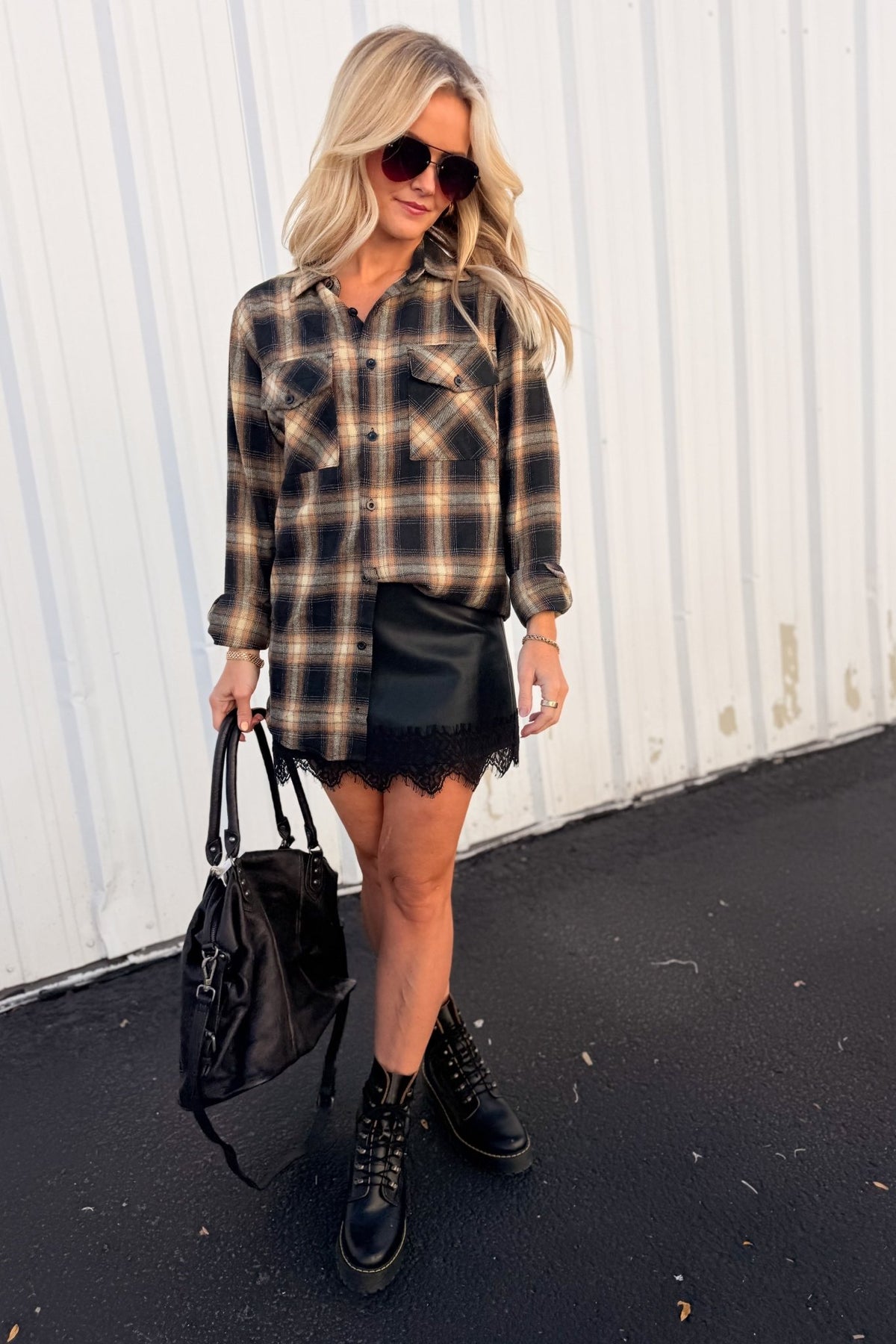 Women’s red, black and cream plaid flannel button-down shirt featuring a relaxed oversized fit, collared neckline, long sleeves, button front closure and dual chest flap pockets. Classic tartan plaid shirt styled as an easy layering piece for casual, grunge-inspired and fall outfits.