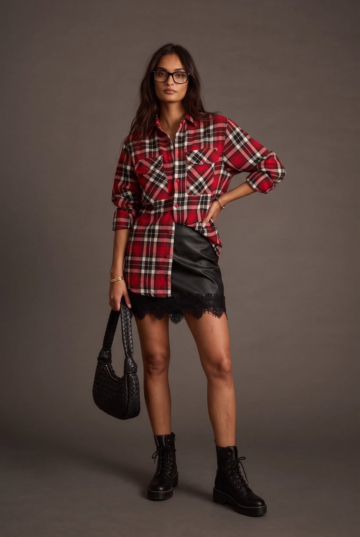 Women’s red, black and cream plaid flannel button-down shirt featuring a relaxed oversized fit, collared neckline, long sleeves, button front closure and dual chest flap pockets. Classic tartan plaid shirt styled as an easy layering piece for casual, grunge-inspired and fall outfits.