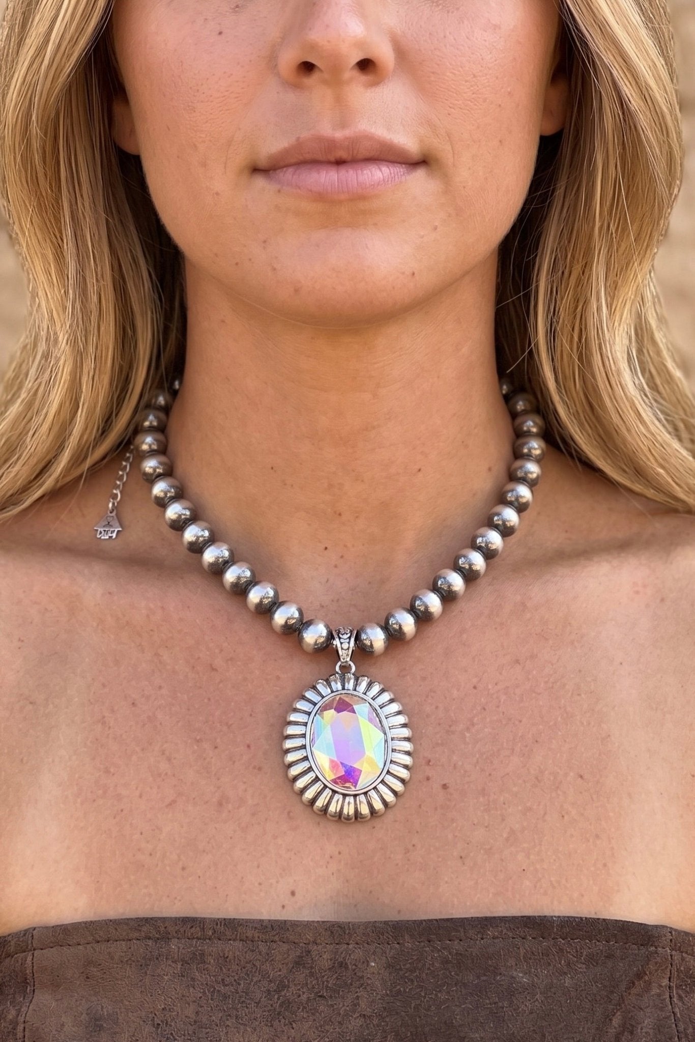 Western silver bead necklace with large iridescent oval pendant