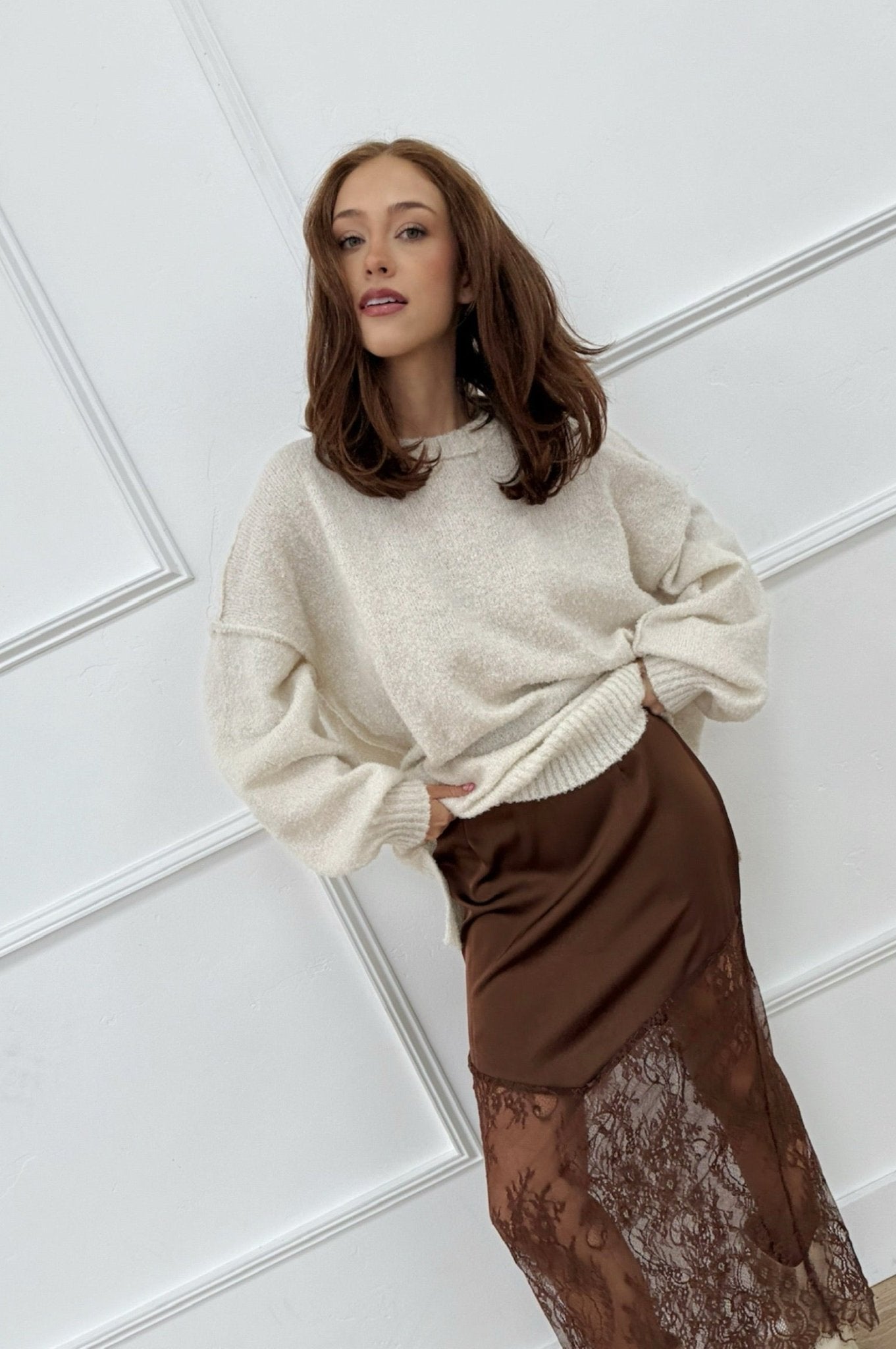 Oversized ivory knit sweater with long sleeves and relaxed fit
