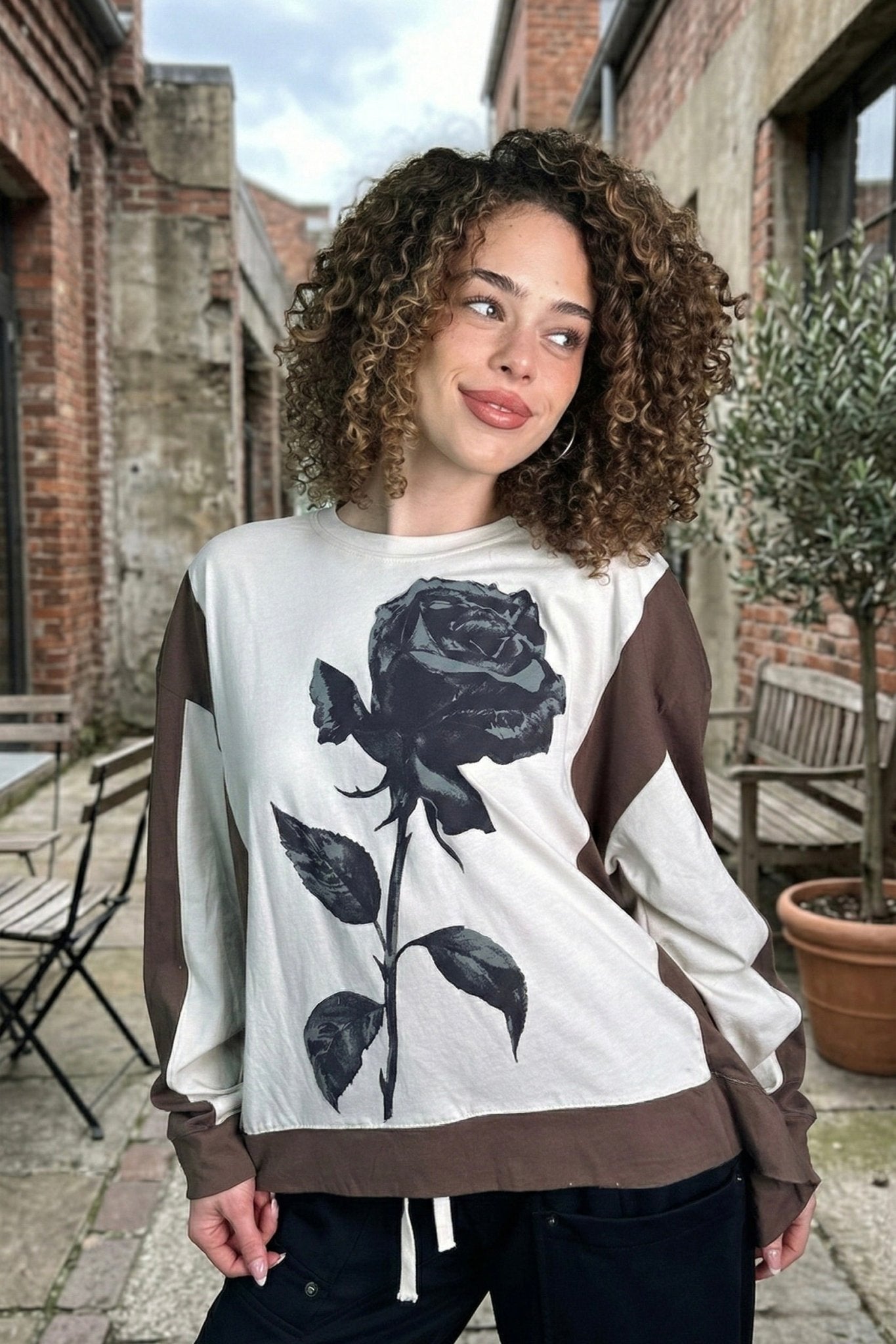 Women’s oversized rose graphic long sleeve top in cream with brown contrast detail and relaxed fit