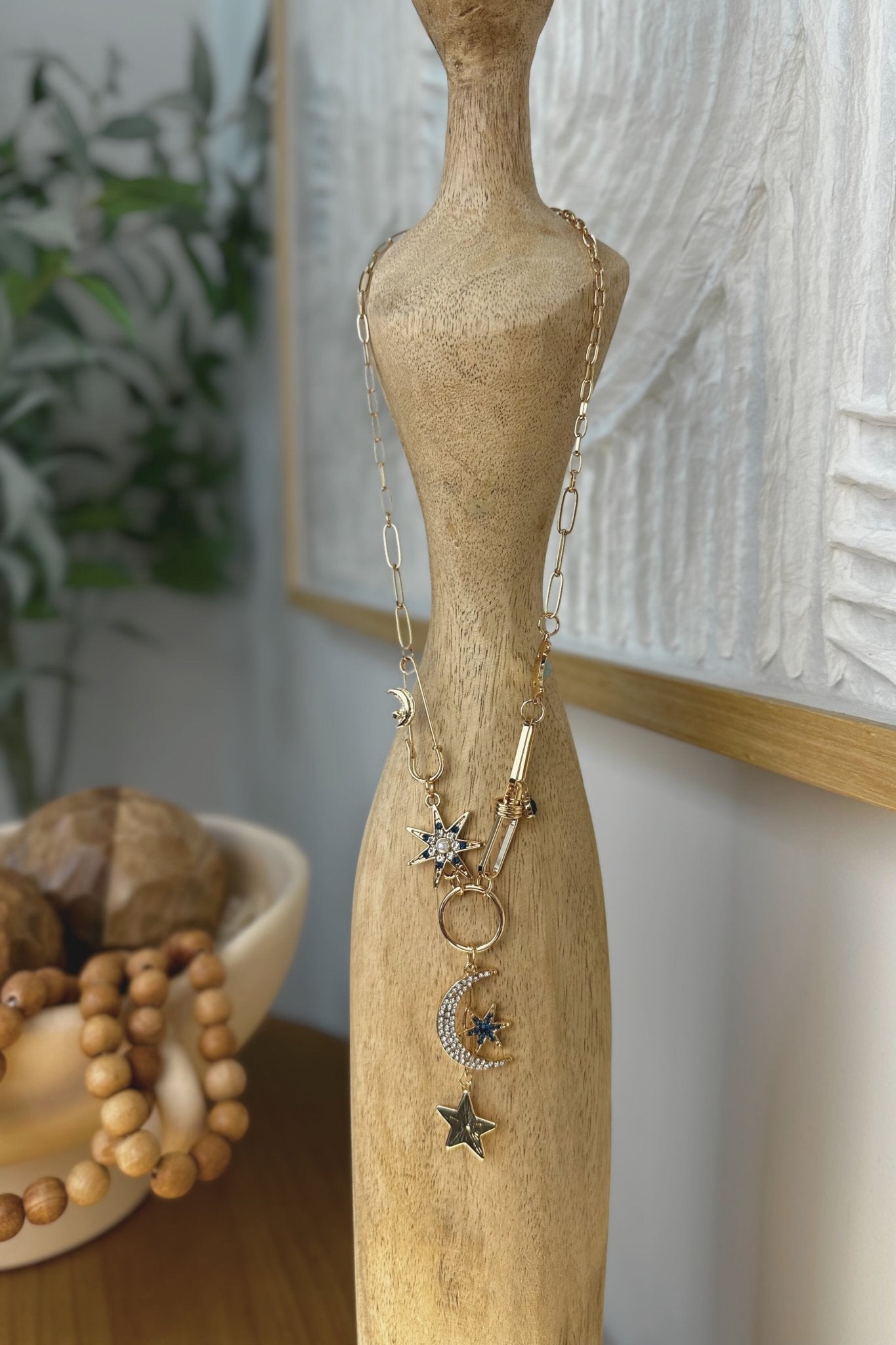 Charm necklace with moon and star charms